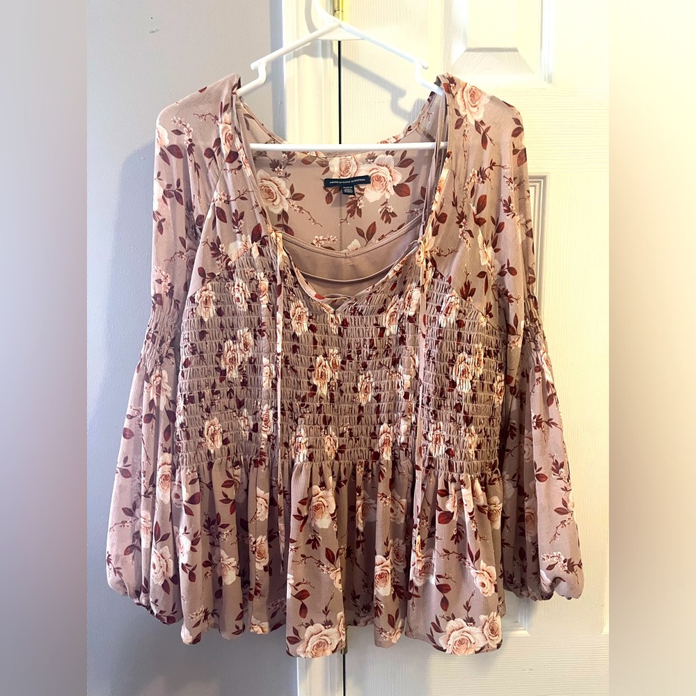 Dressy blouse from American Eagle.  Color pink and mauve. Size medium.